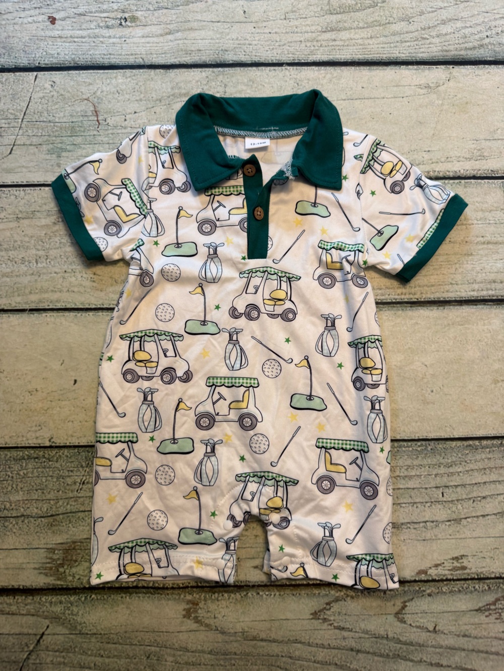 Unbranded green and white golf cart club ball pattern  romper. 12-18 months
